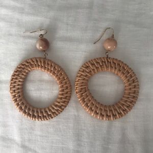 Woven circle hoop dangling earrings with a bead